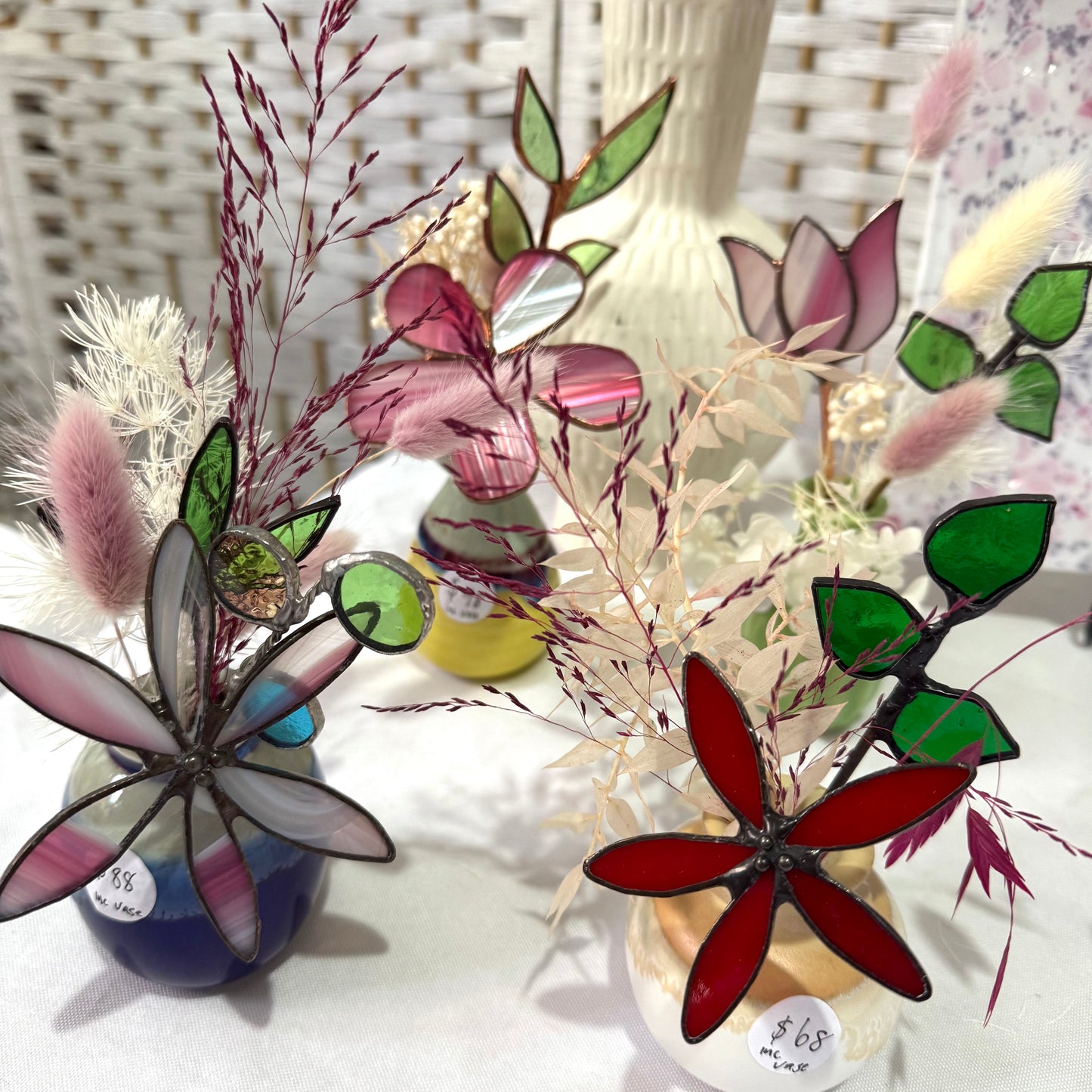 A variety of little vases with flowers