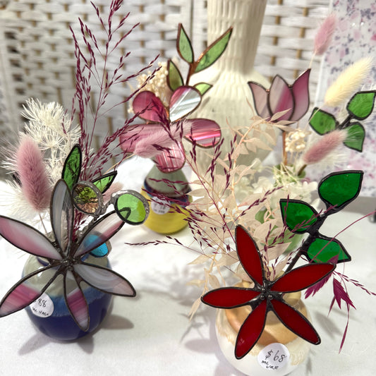 A variety of little vases with flowers