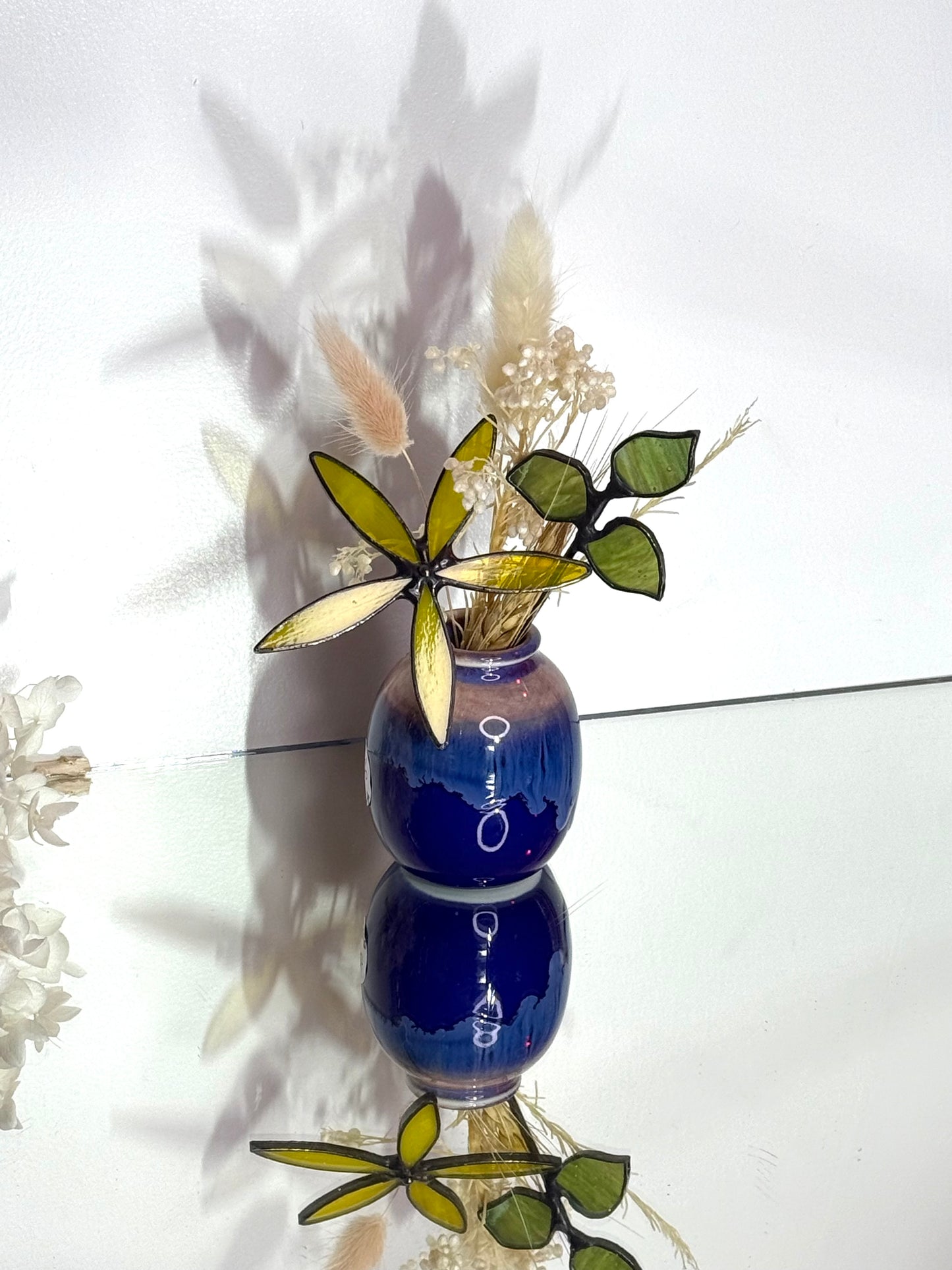 A variety of little vases with flowers