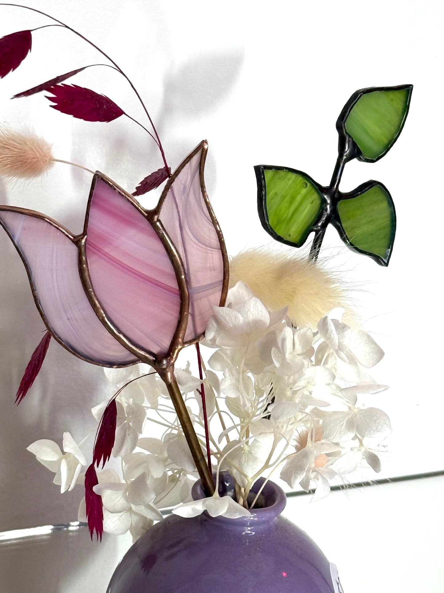 A variety of little vases with flowers