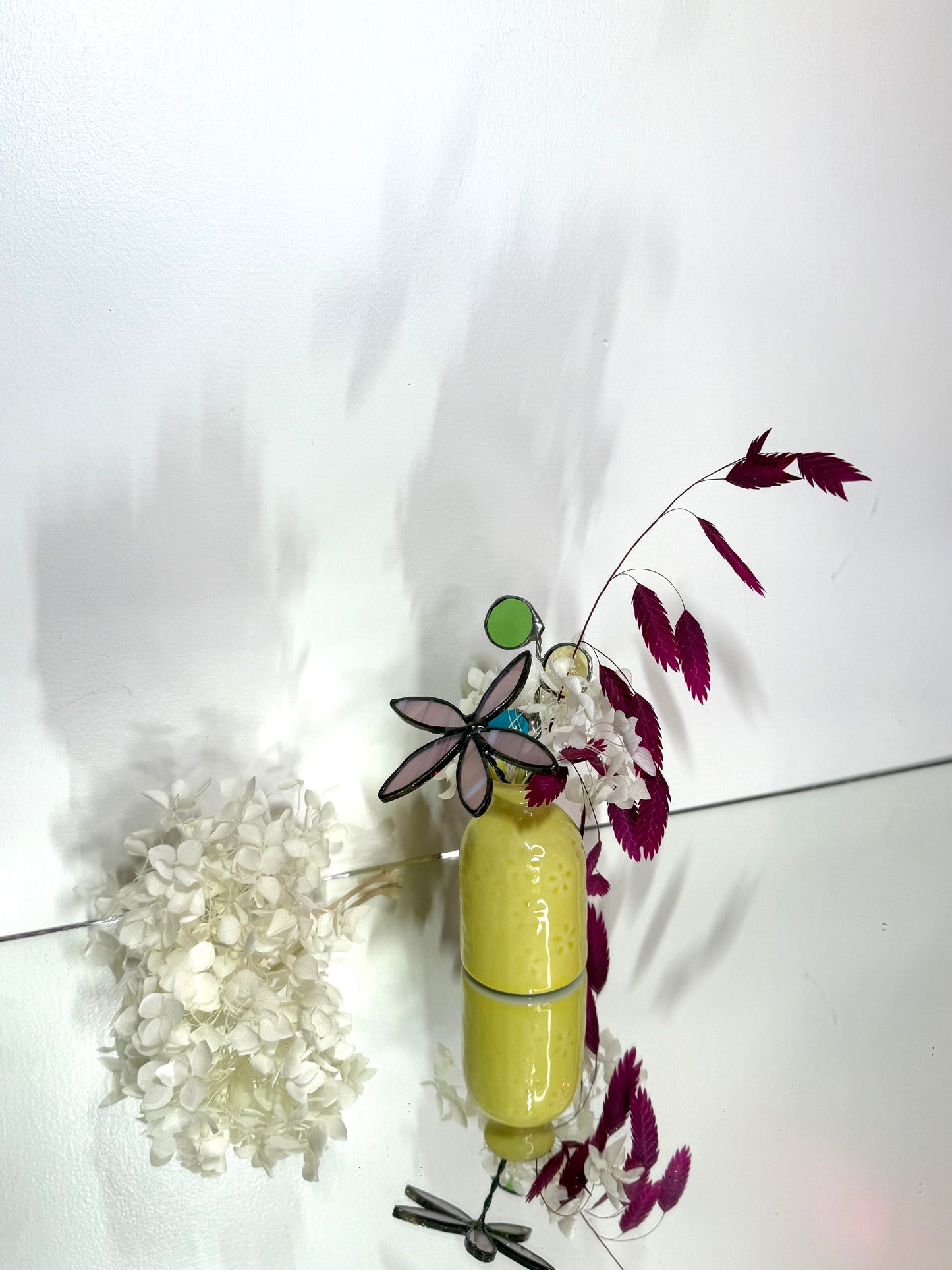 A variety of little vases with flowers