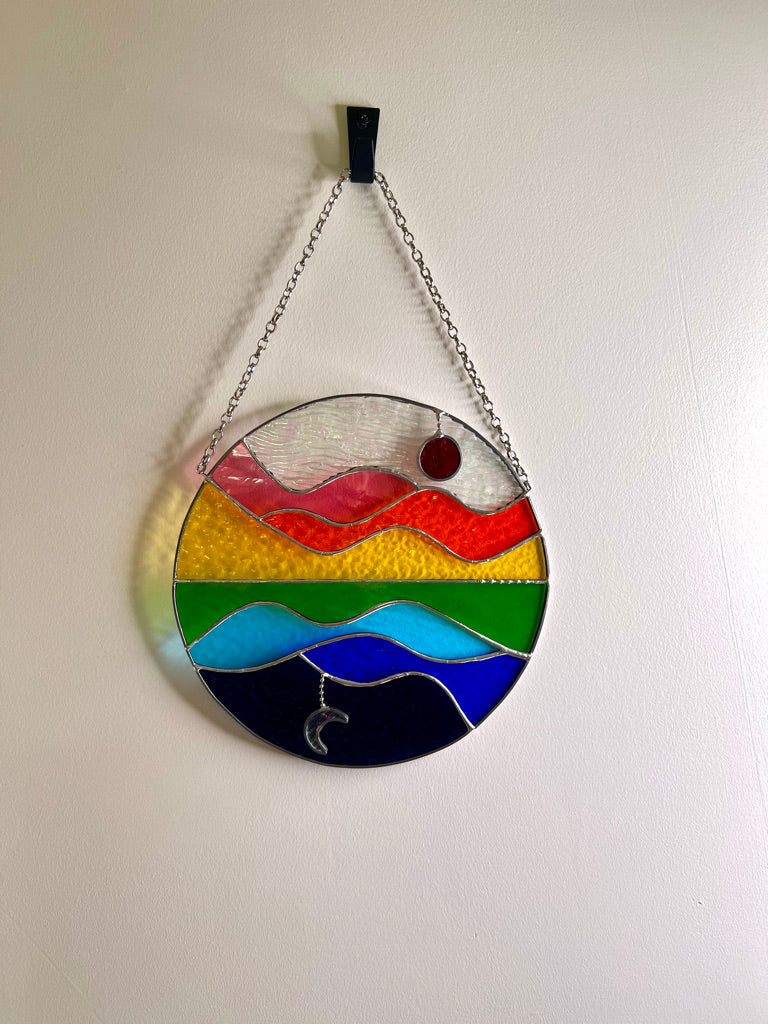 Summer Celebration, sun, moon, water, hills and sky stained glass suncatcher