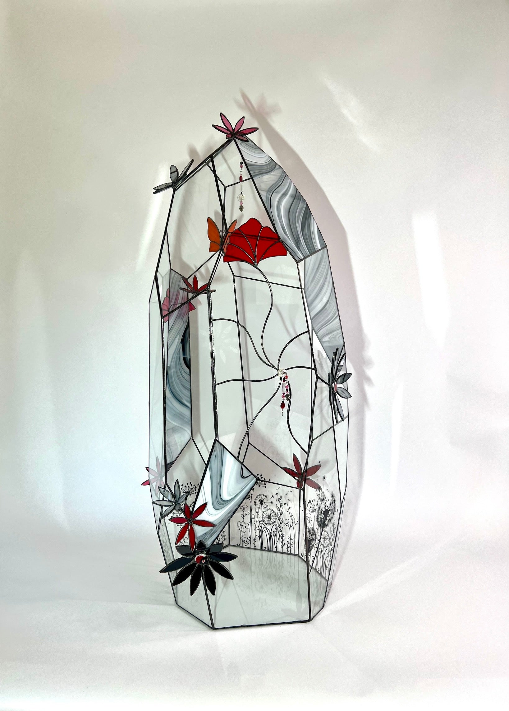 Glass terrarium, flowers, butterfly, crystals