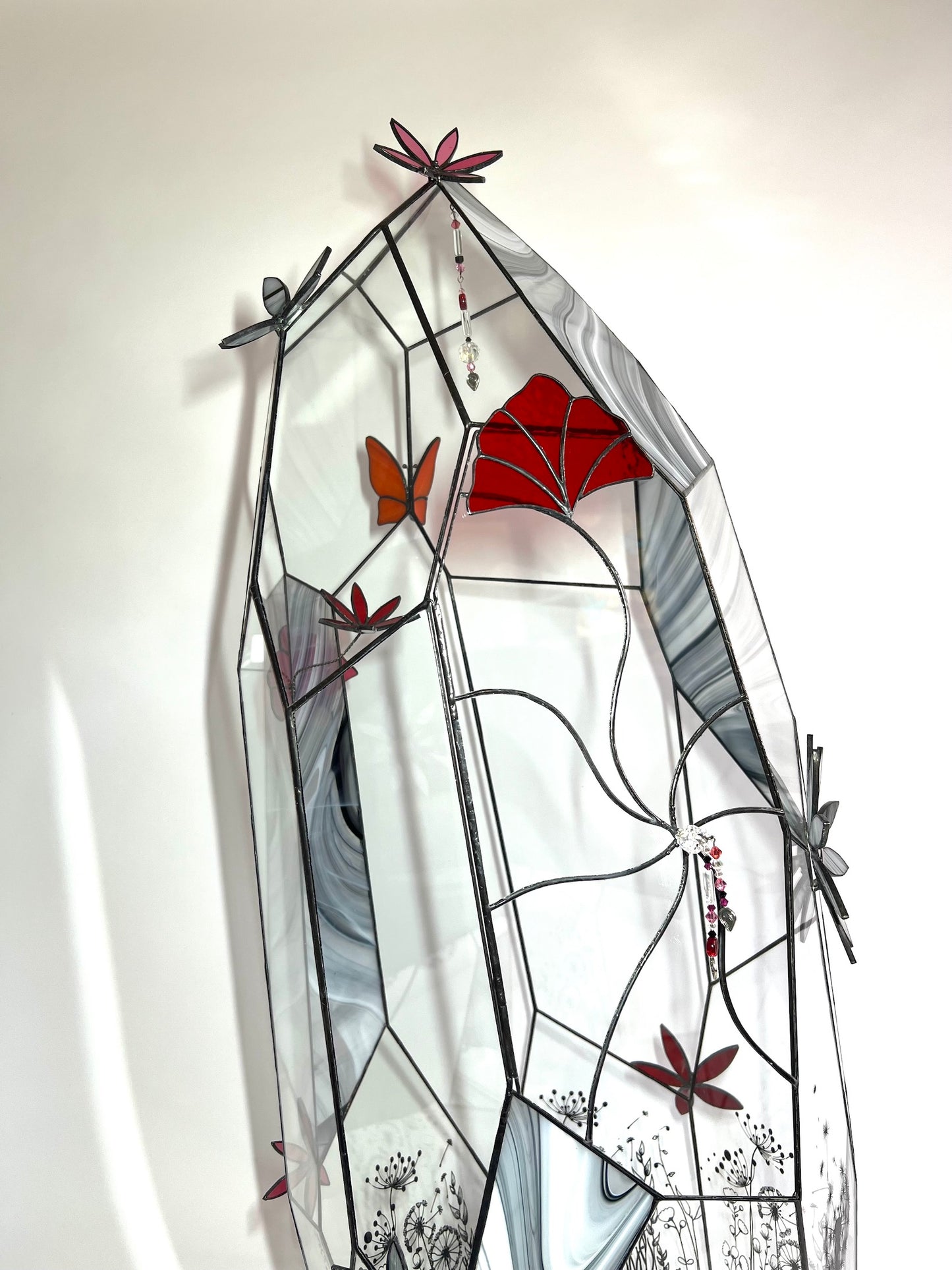 Glass terrarium, flowers, butterfly, crystals