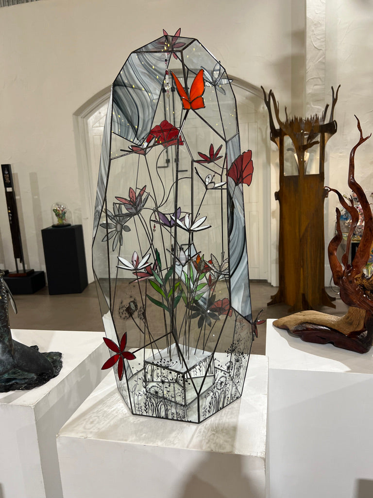 Glass terrarium, flowers, butterfly, crystals