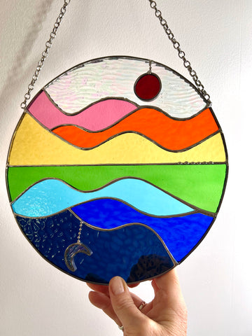 Summer Celebration, sun, moon, water, hills and sky stained glass suncatcher