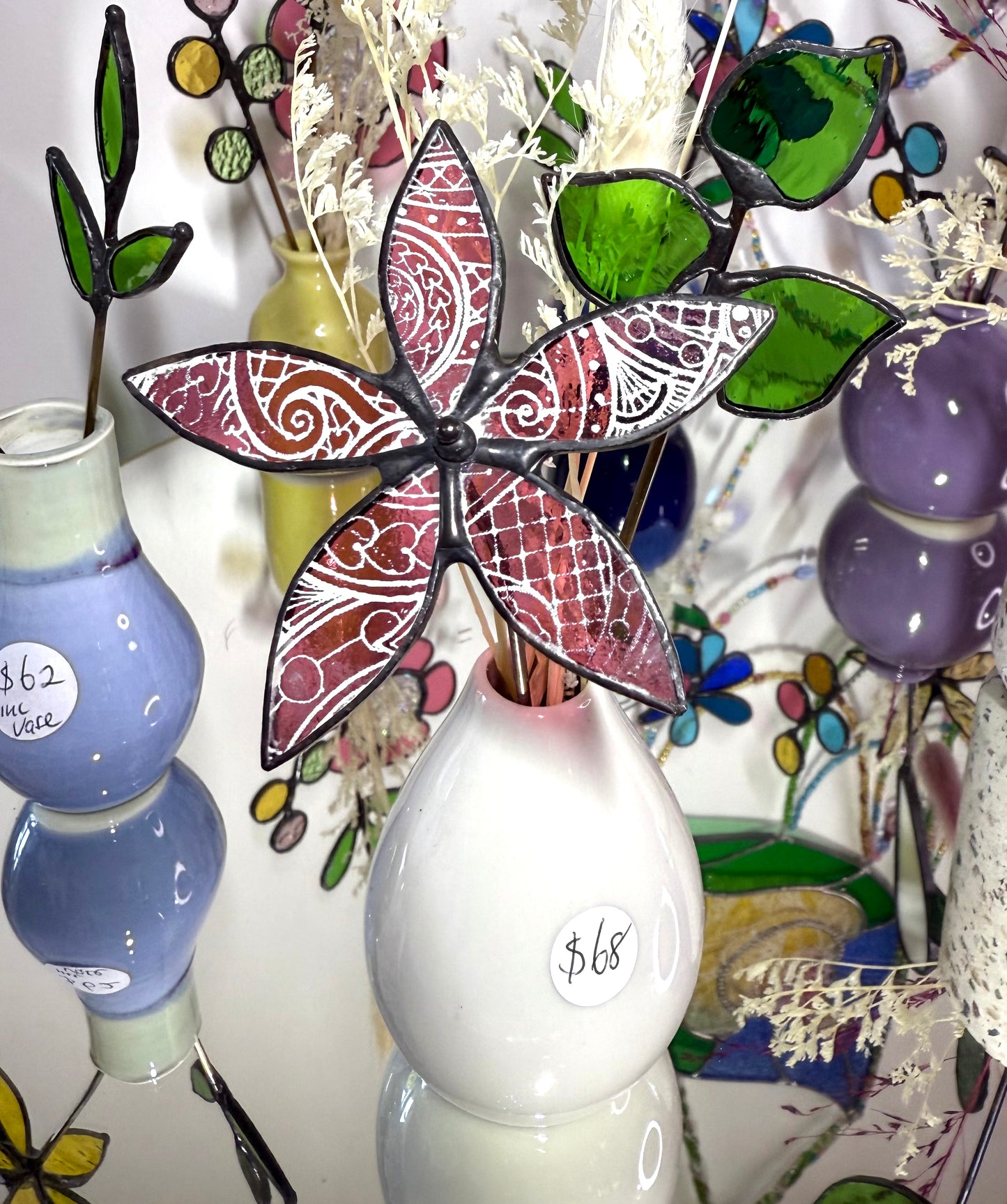 A variety of little vases with flowers