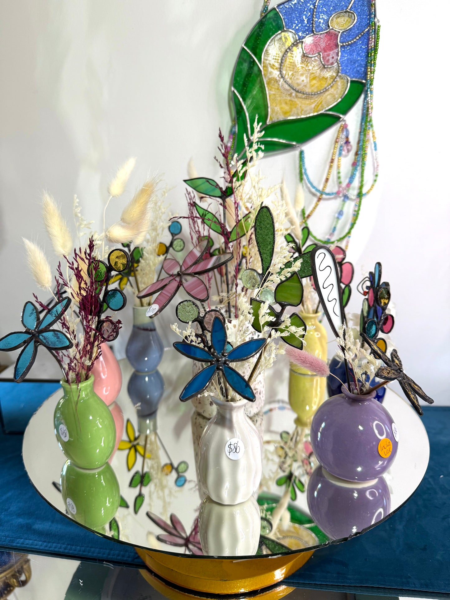 A variety of little vases with flowers