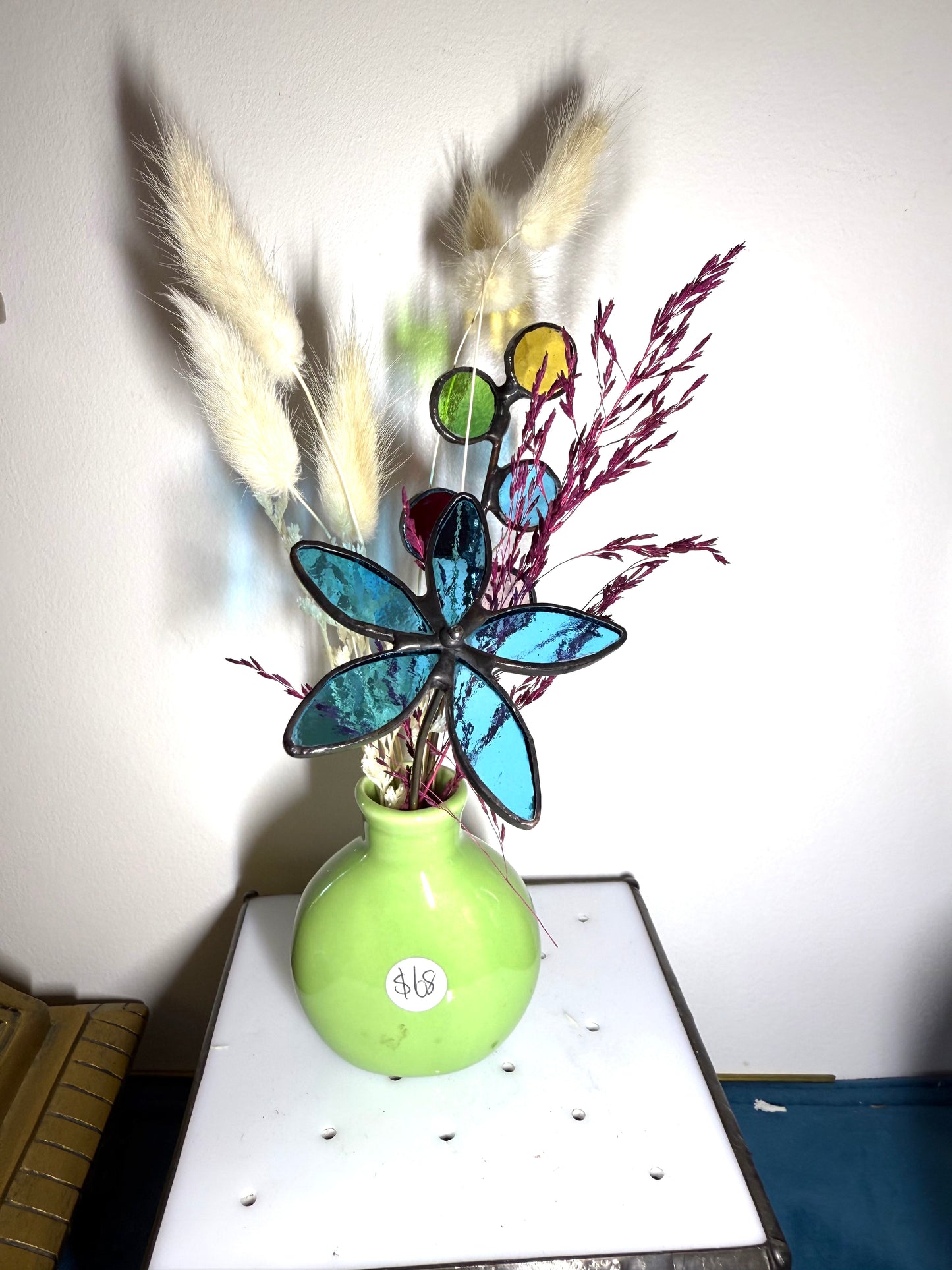 A variety of little vases with flowers