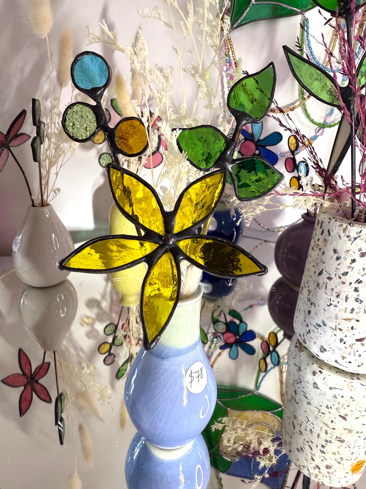 A variety of little vases with flowers