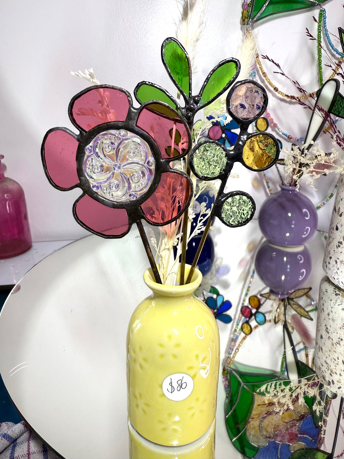 A variety of little vases with flowers