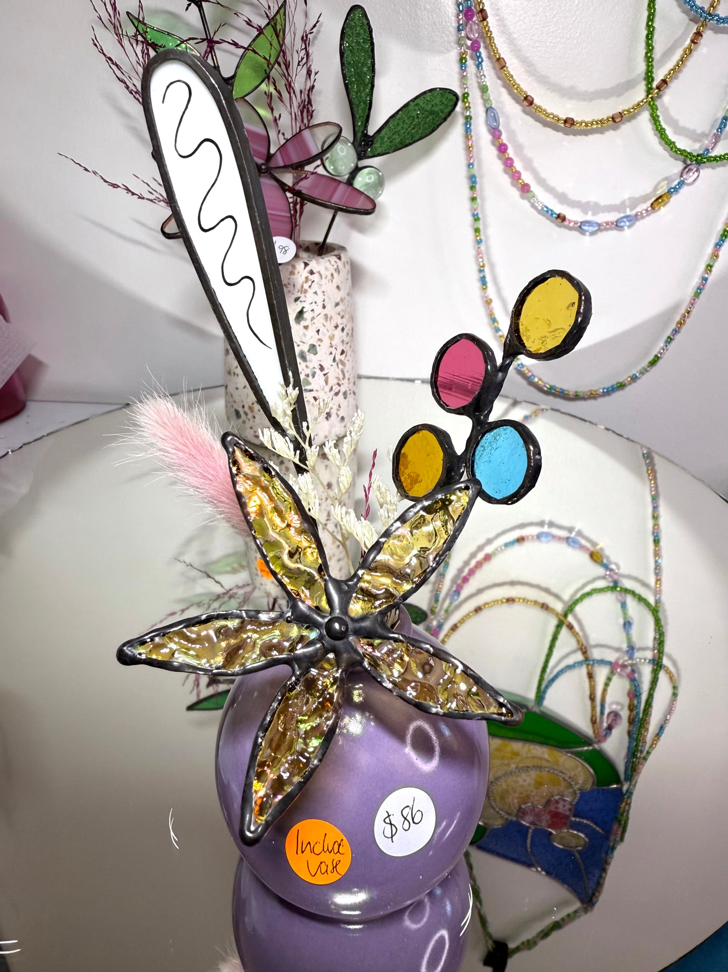 A variety of little vases with flowers