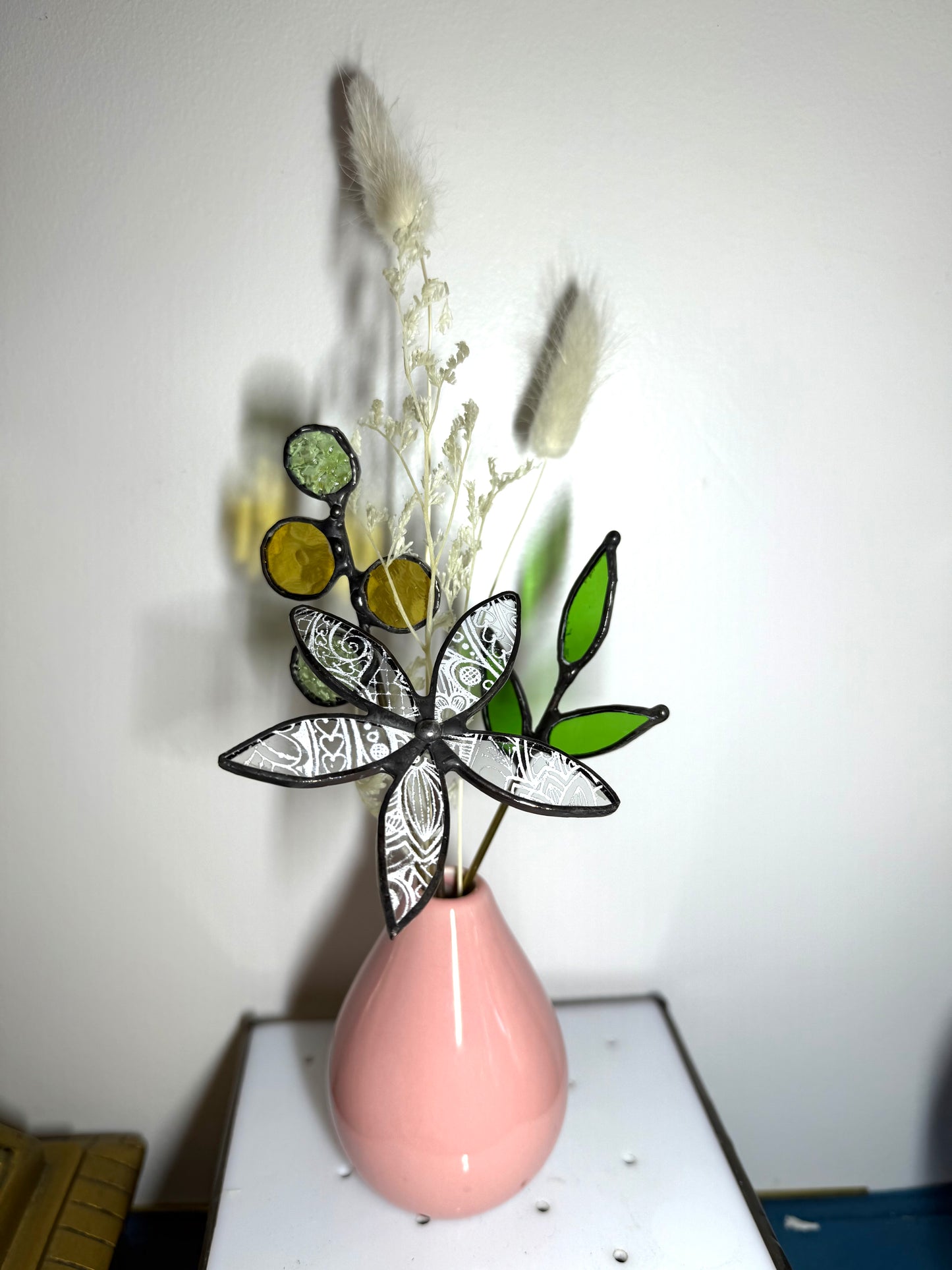 A variety of little vases with flowers