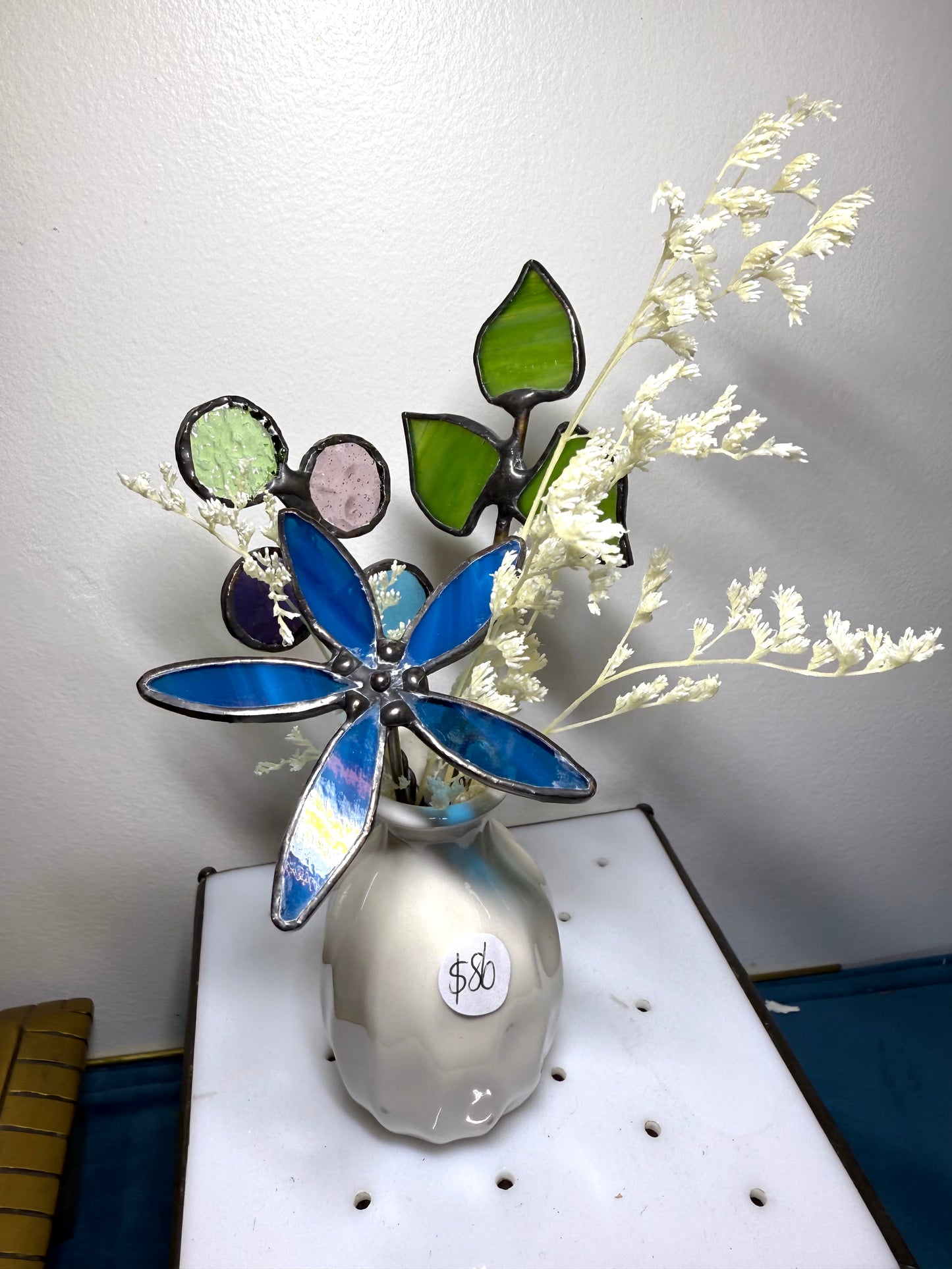 A variety of little vases with flowers