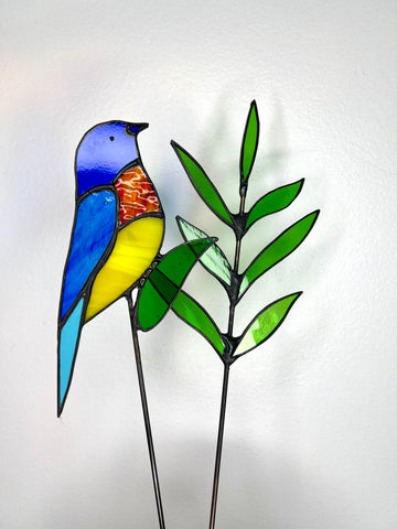 stainedglass rainbow bird and green leaf