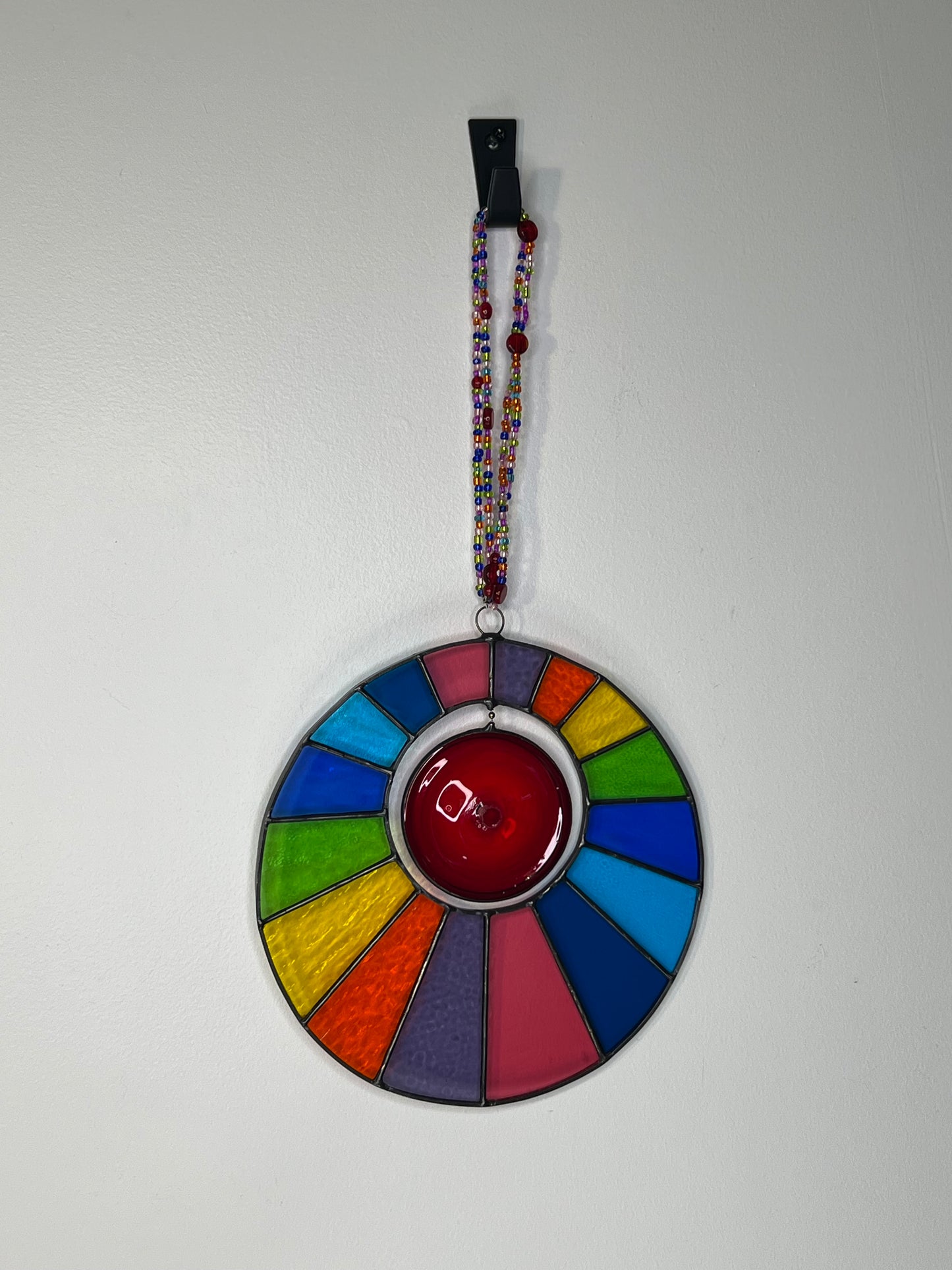 Rainbow disk with spinning centre