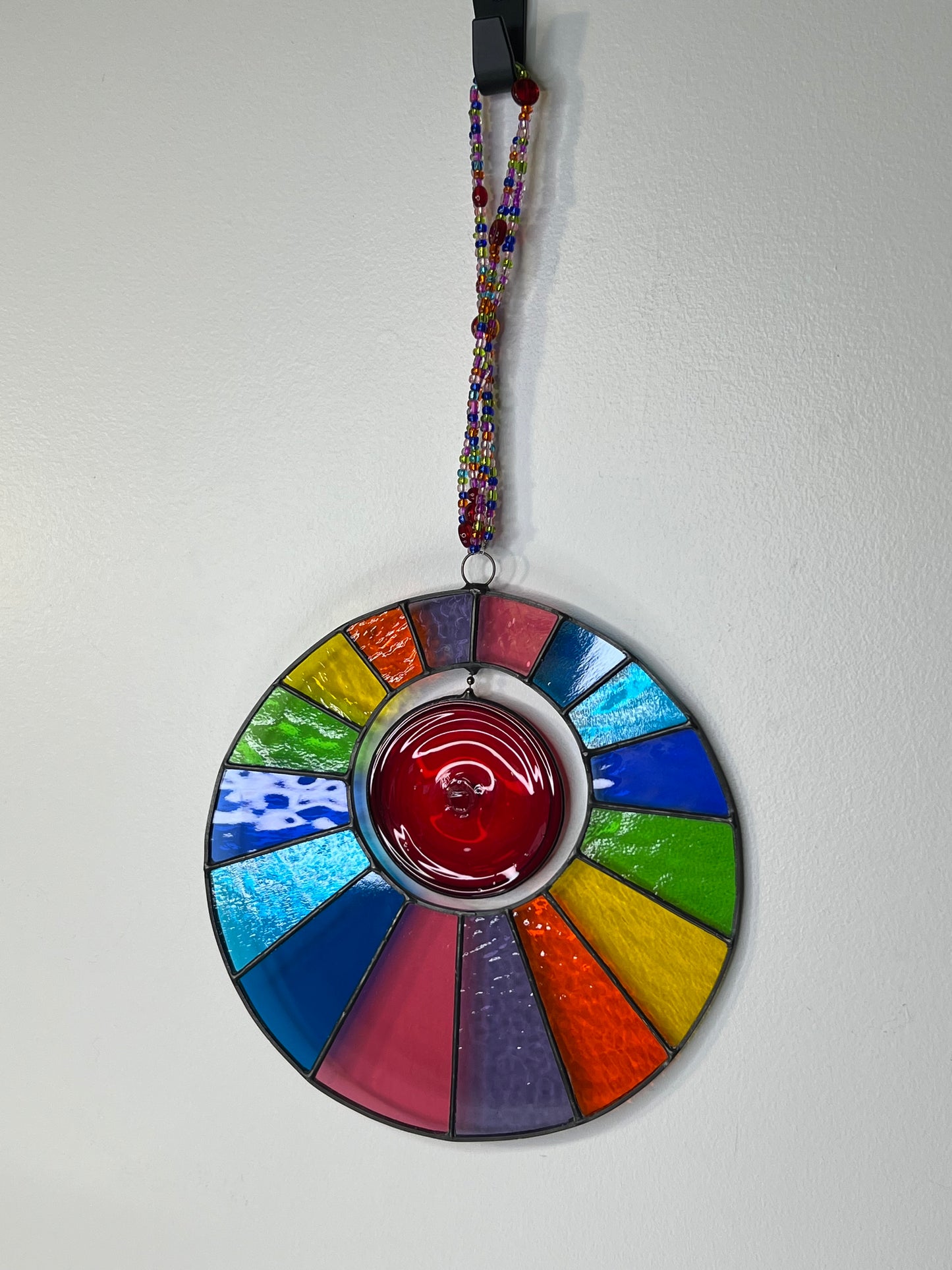 Rainbow disk with spinning centre