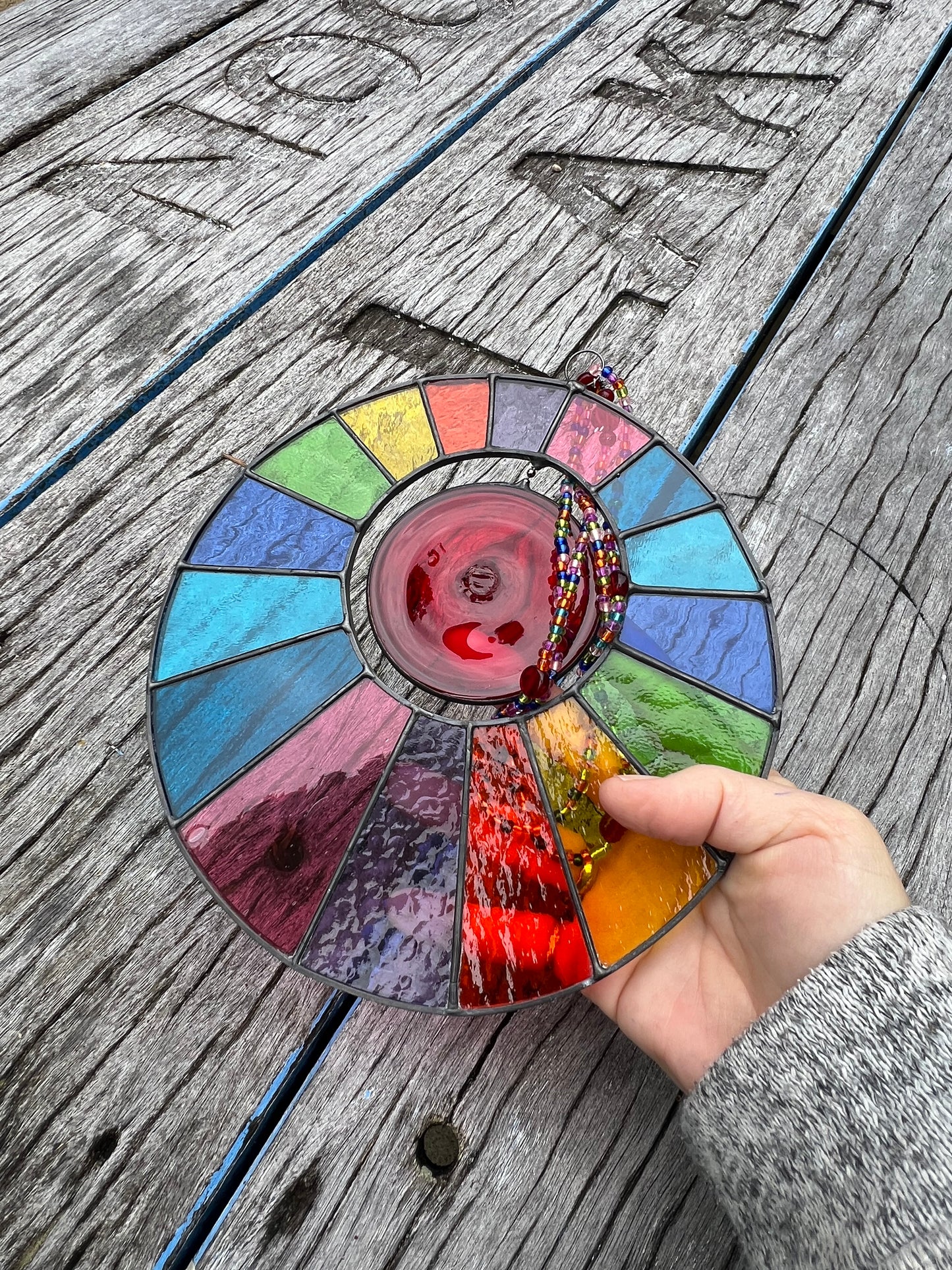 Rainbow disk with spinning centre