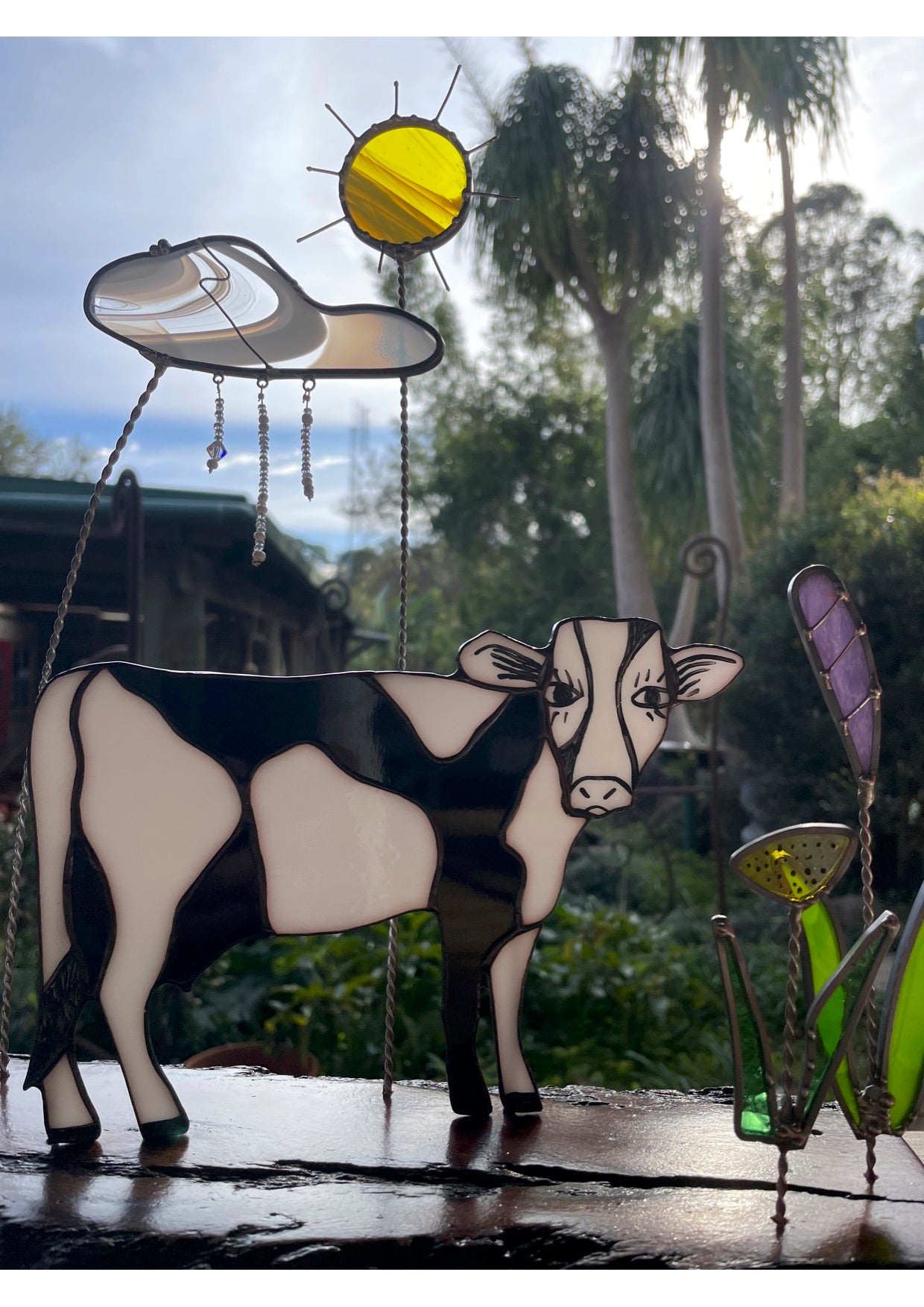 Black and White leadlight cow with flowers, sun, rainy cloud