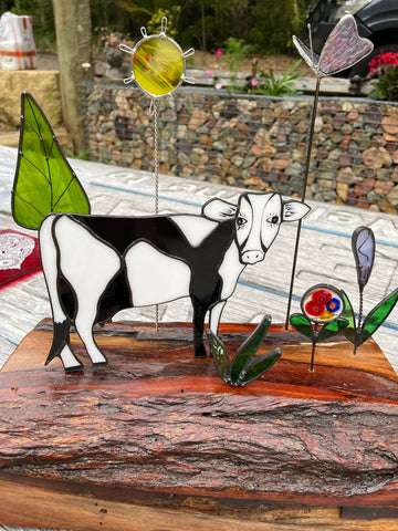 Black and White Glass Cow with Flowers and Tree and Sun
