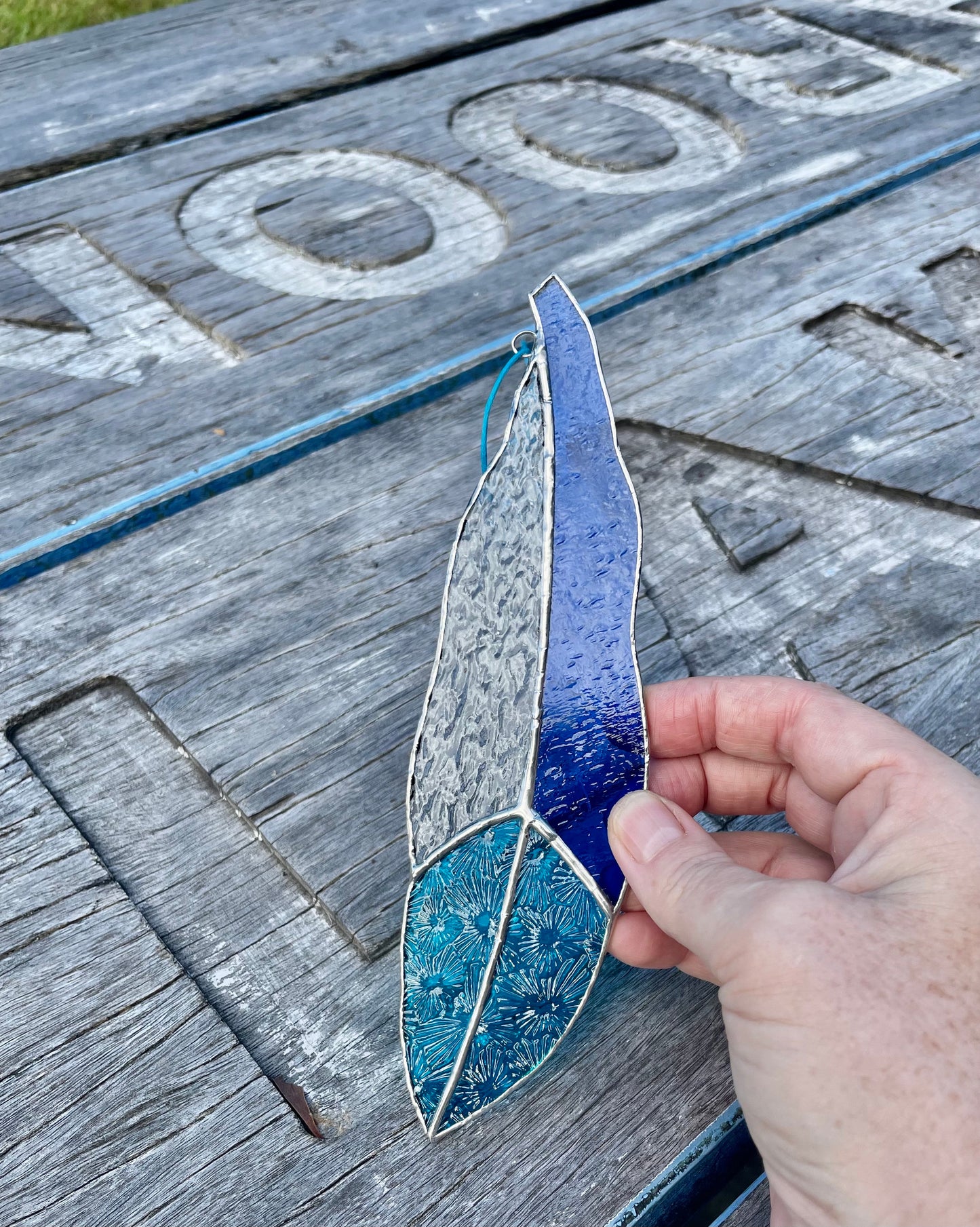 blue and texture clear glass feather