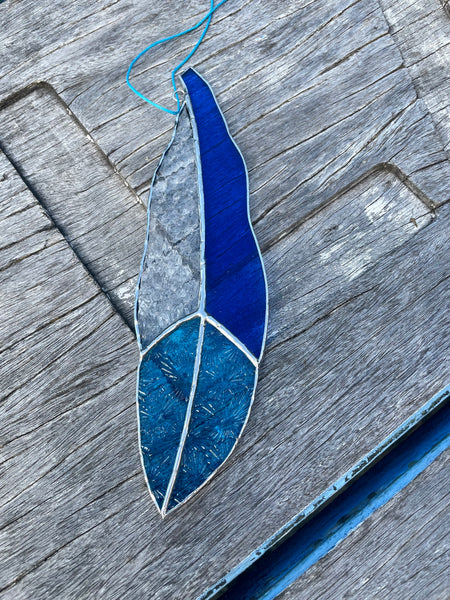 blue and texture clear glass feather
