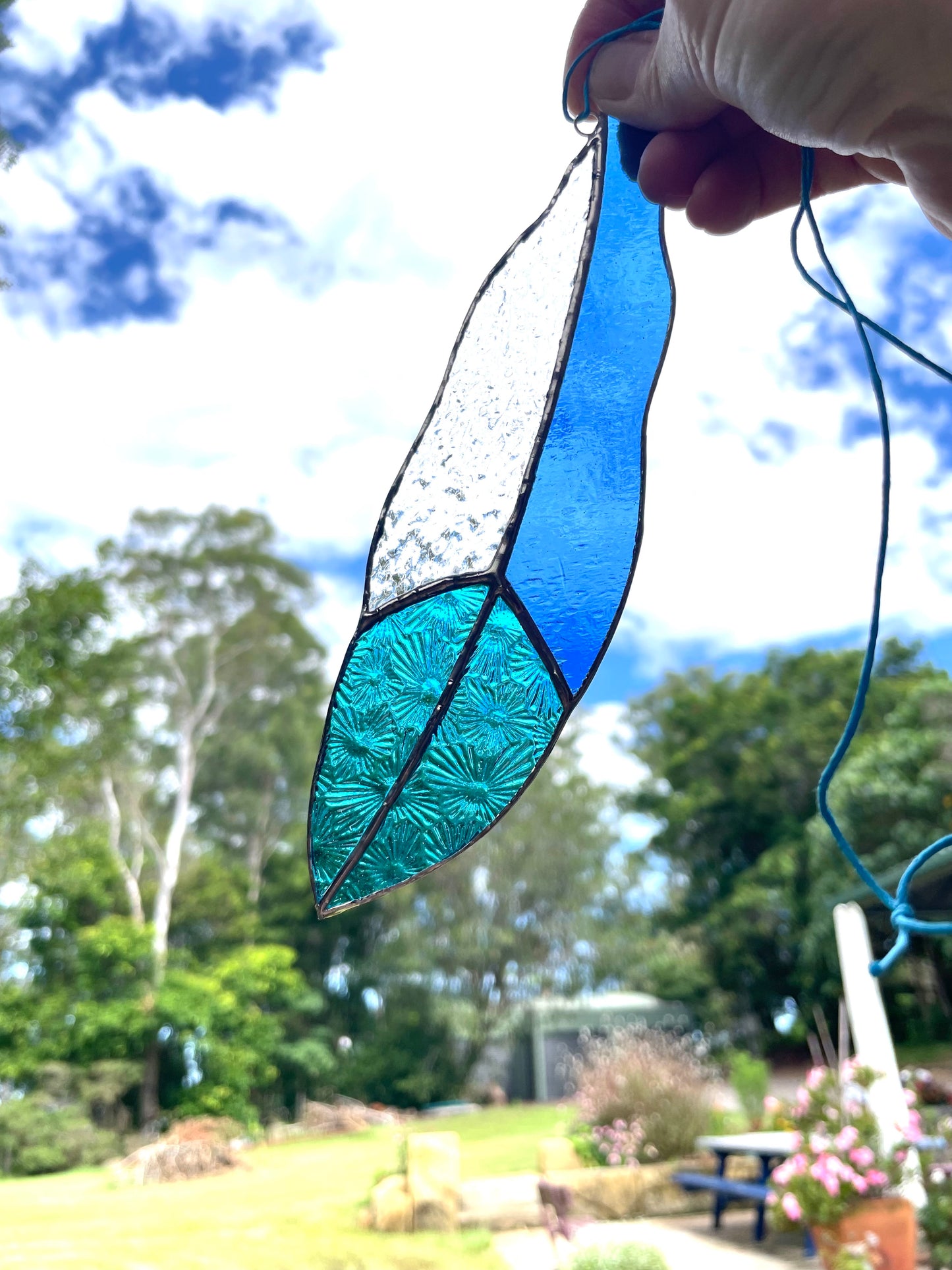 blue and texture clear glass feather