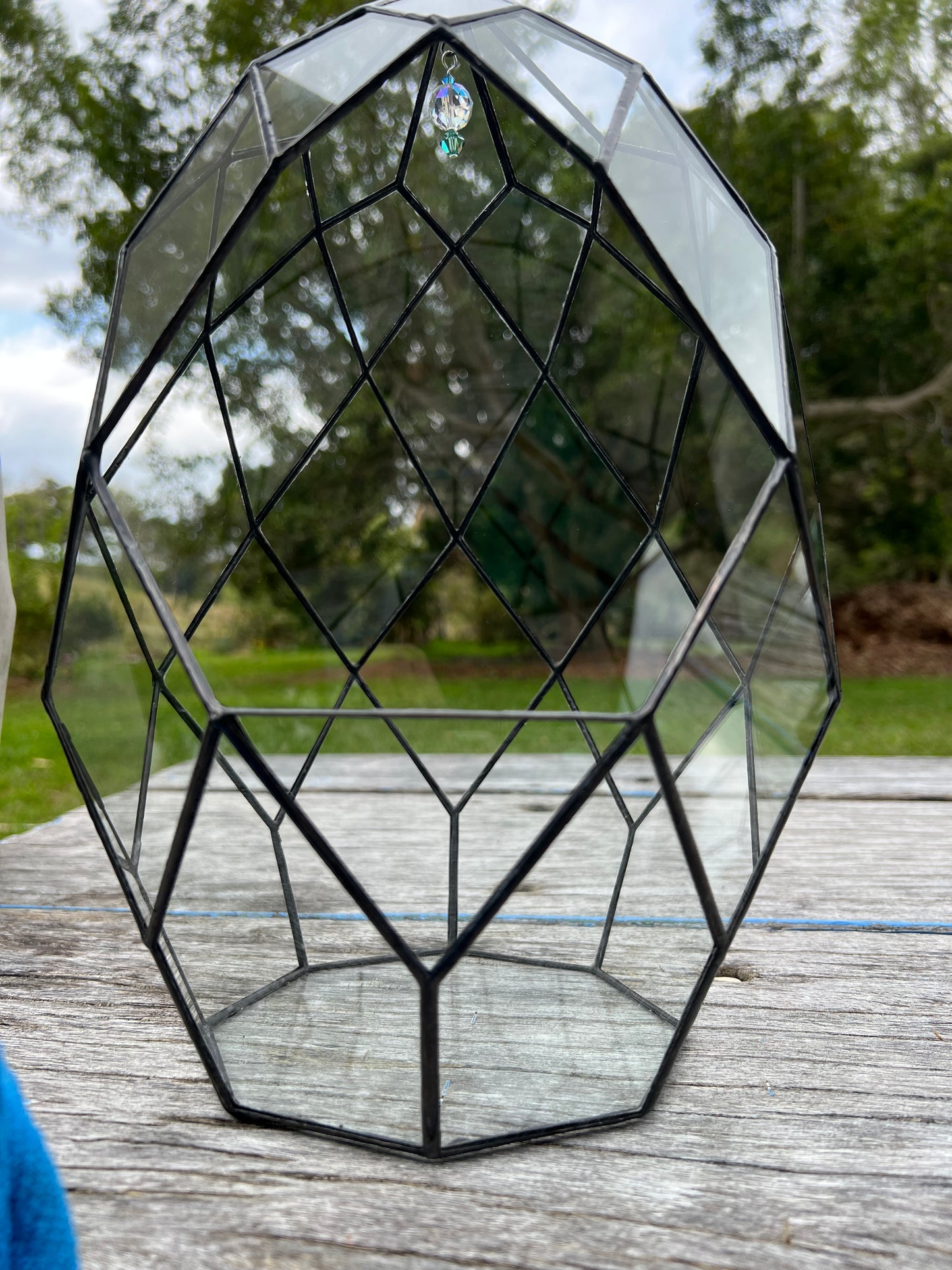 clear glass terrarium with crystal decoration